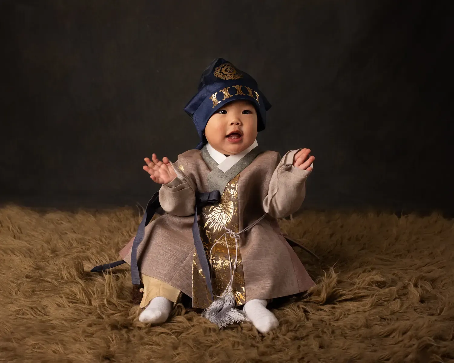 Baby boy at first birthday photo shoot in Han Bok