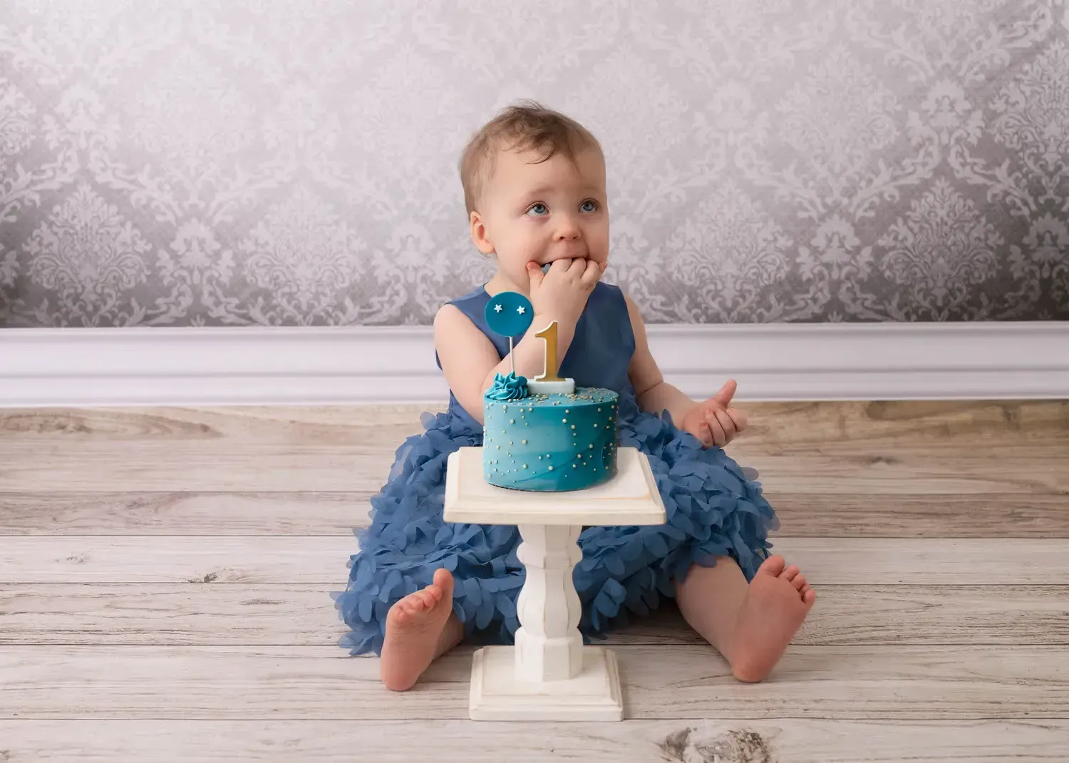 Girl in blue dress with blue cake. First Birthday  Photoshoot
