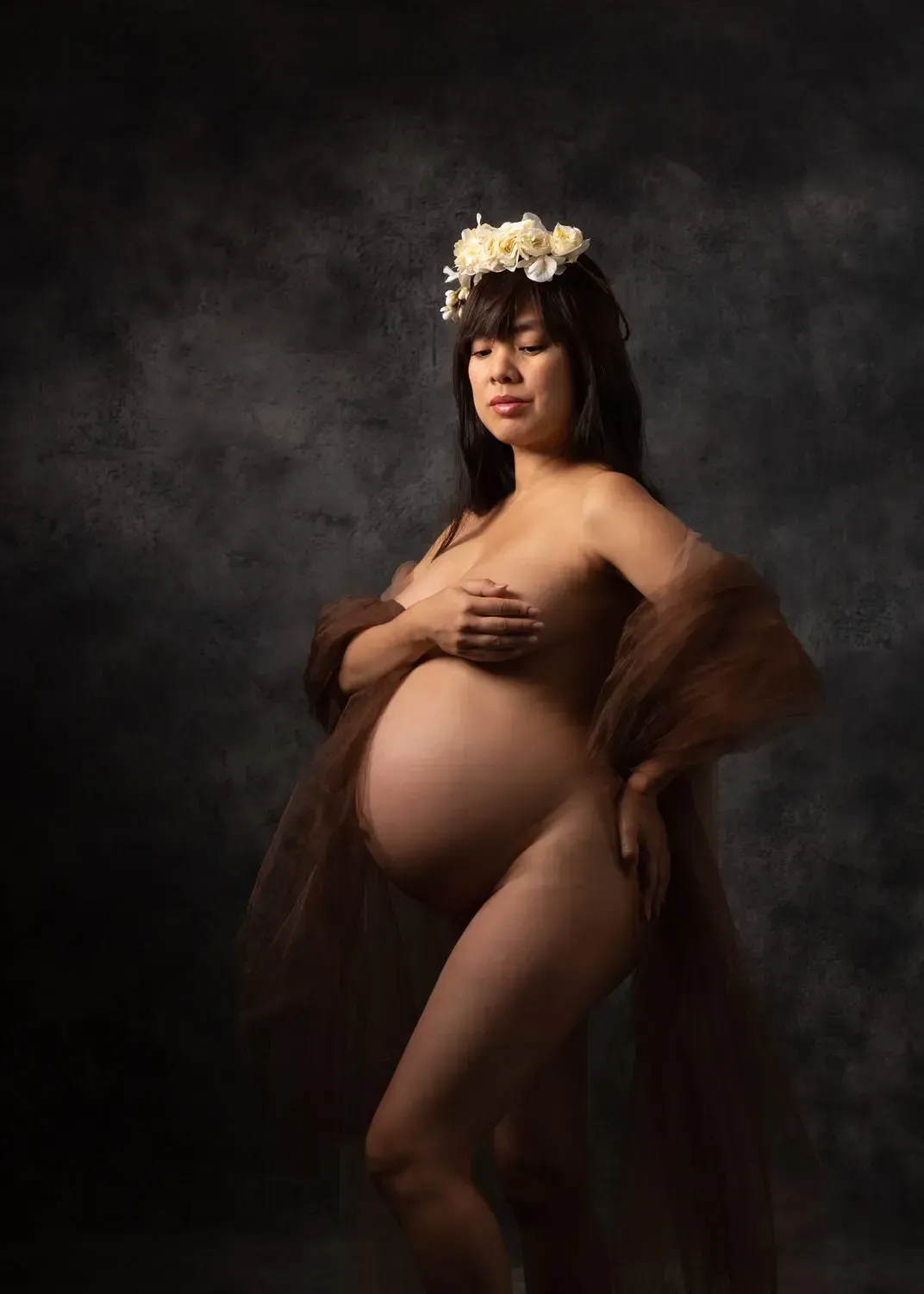 Dramatic implied nude pregnancy photo