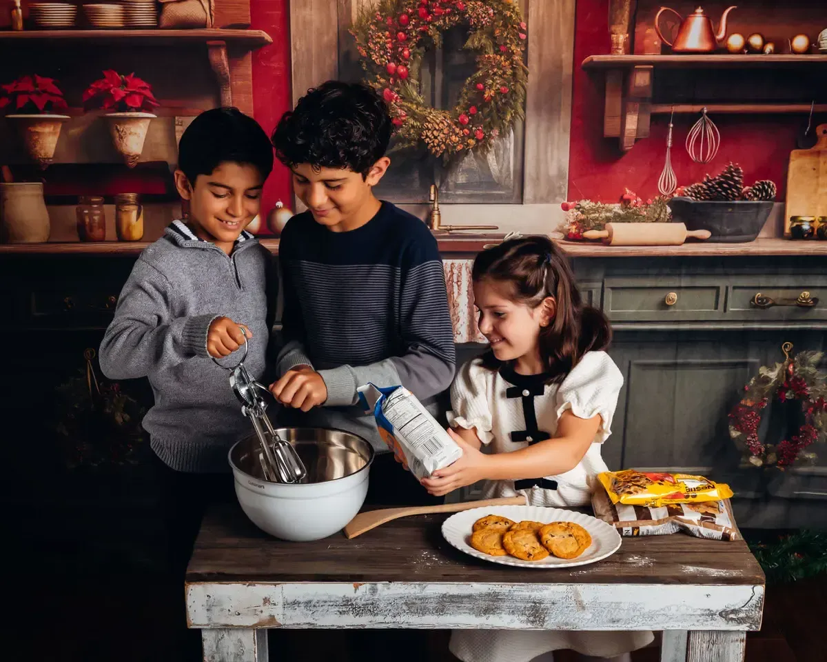 Cute kids baking holiday cookies.