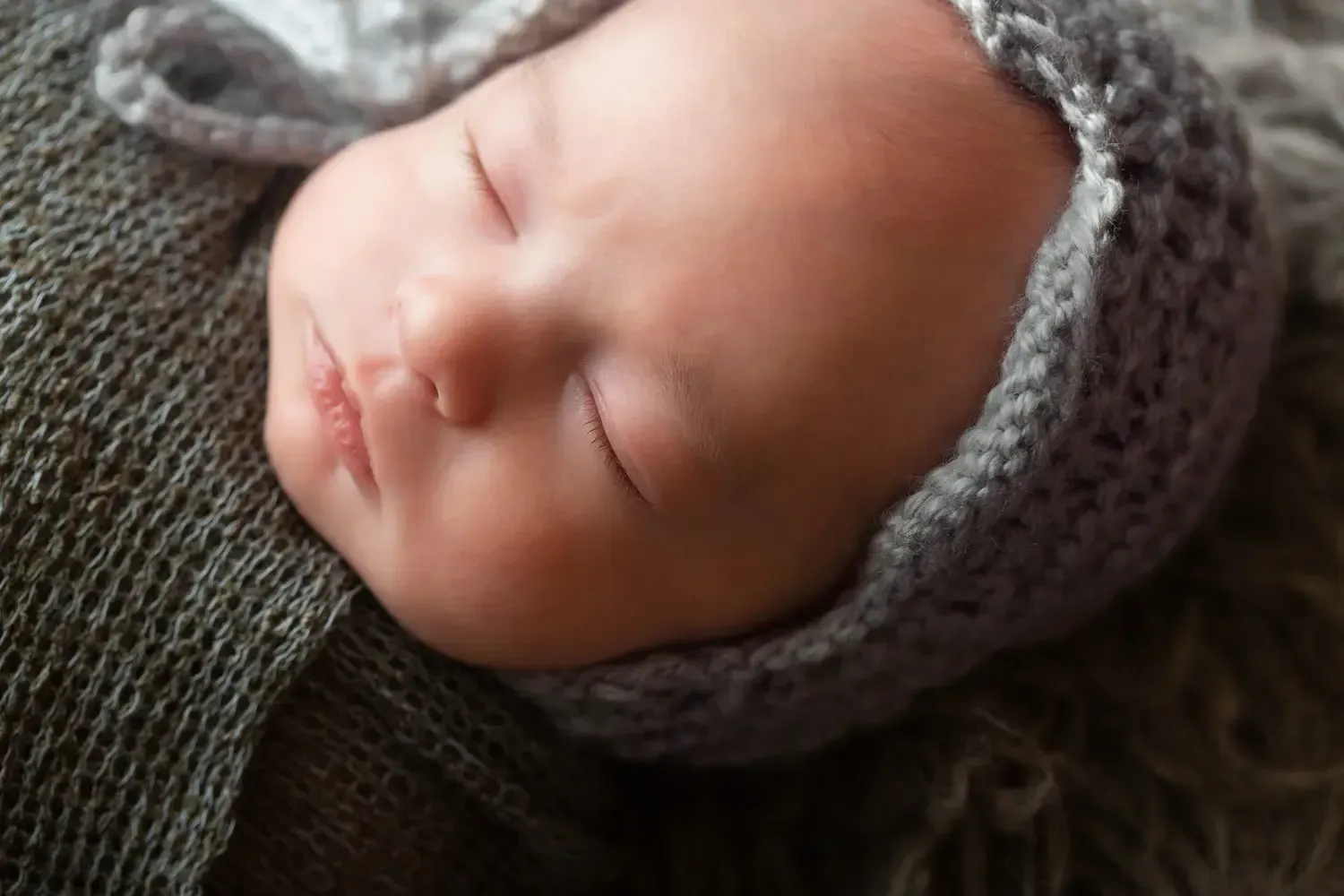 Close up of newborn boy's eyelashes.