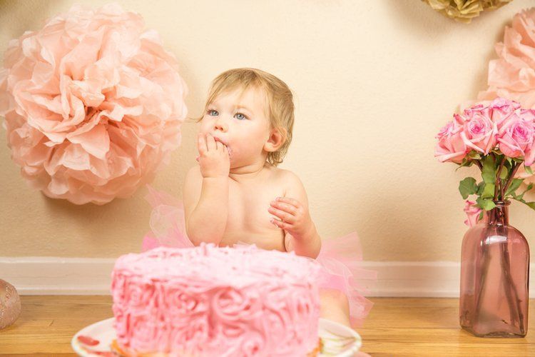 Baby girl  at a cake smash. Pink theme.