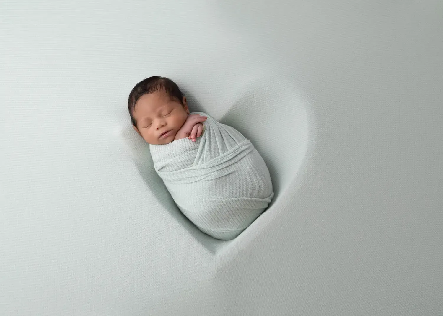 Glendale photography Newborn Boy In Heart Prop