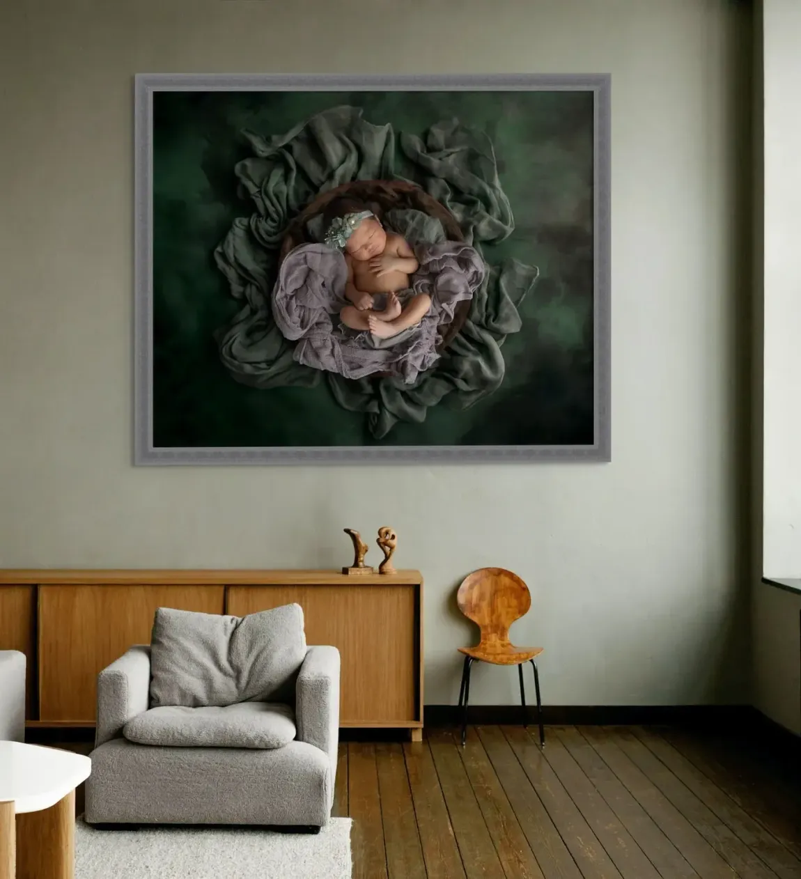 Framed art of newborn baby in family home.