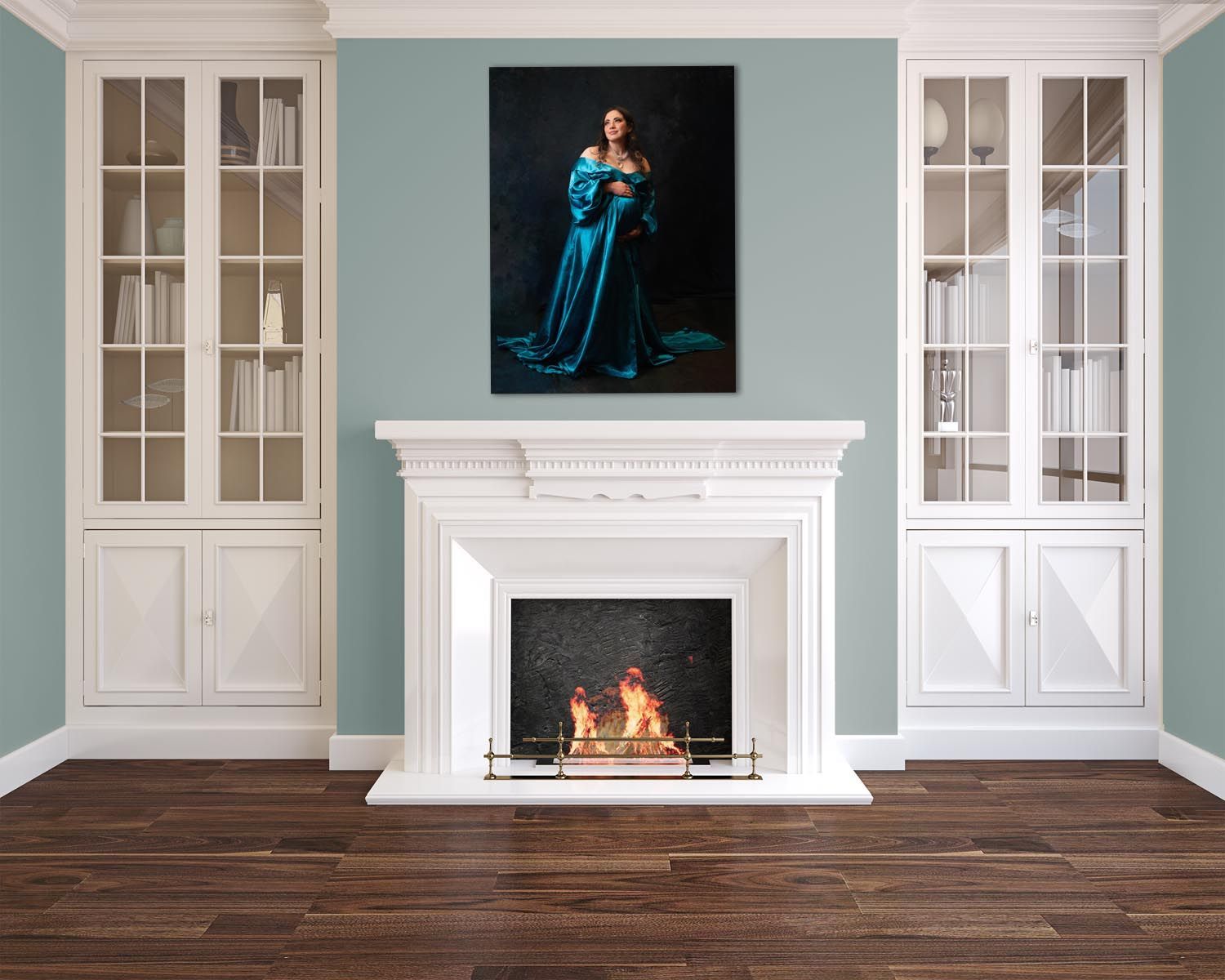 Glendale maternity Modern hearth with pregnancy portrait hung above. Blue flowing gown. 