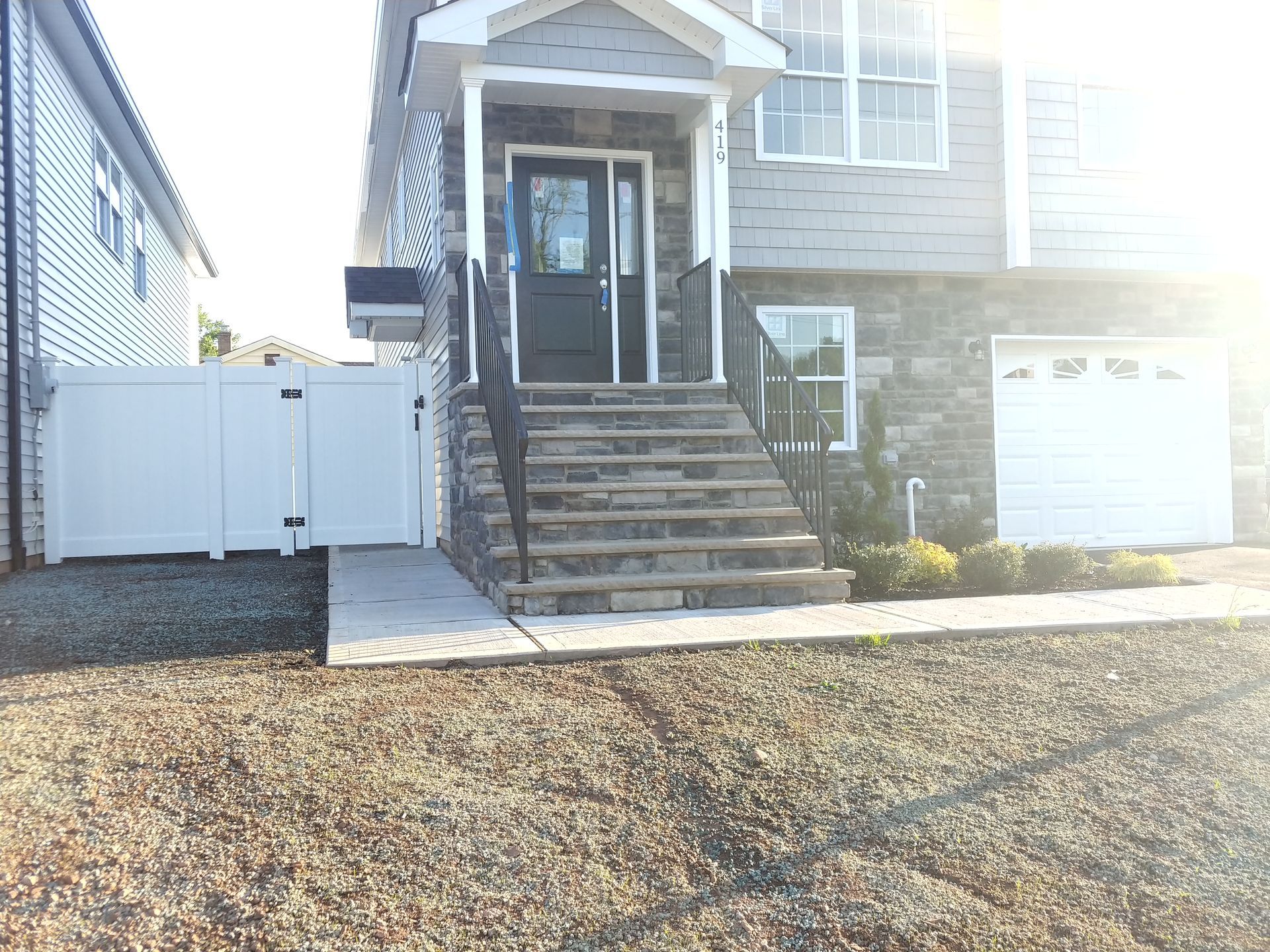 A house with stairs leading up to the front door