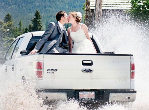 bride and groom in truck with accessories