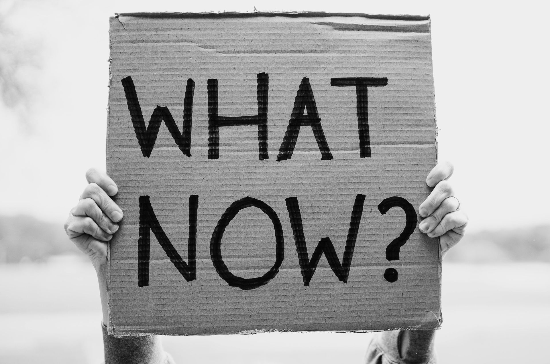 poster with words what now written