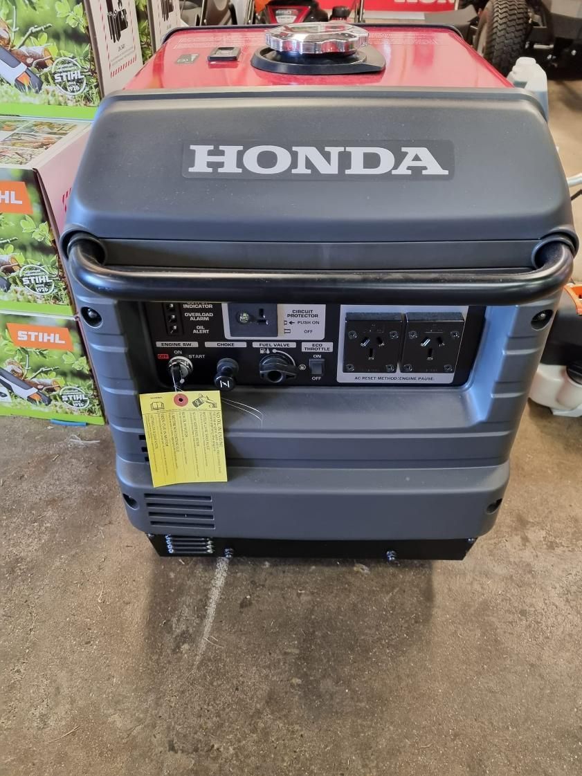 A Honda Generator is Sitting on the Ground in a Garage — Urunga Chainsaw and Mower in Urunga, NSW