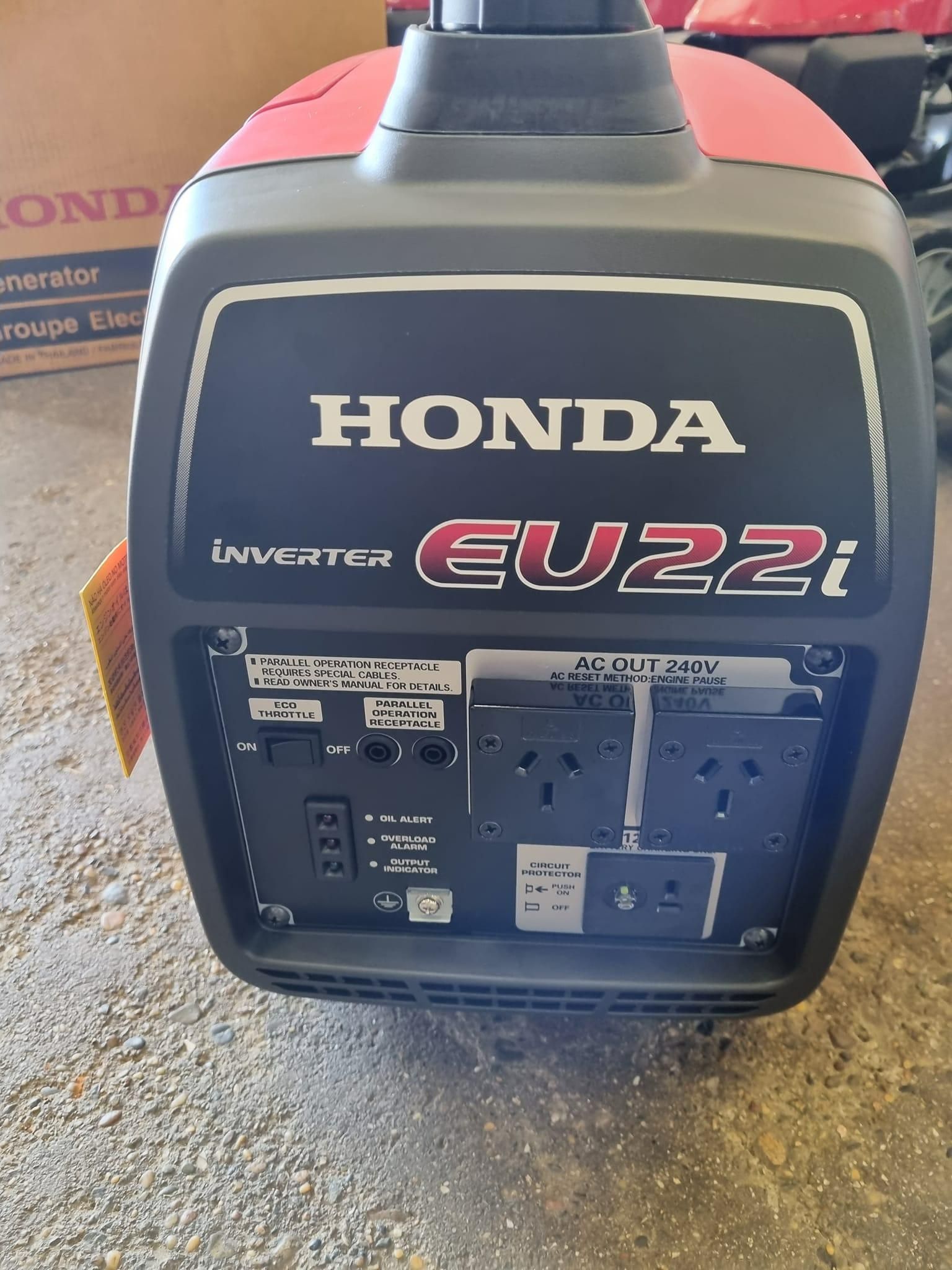 A Honda Generator is Sitting on Top of a Cement Floor — Urunga Chainsaw and Mower in Urunga, NSW