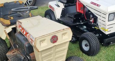 Two Lawn Mowers Are Parked Next to Each Other on the Grass — Urunga Chainsaw and Mower in Urunga, NSW