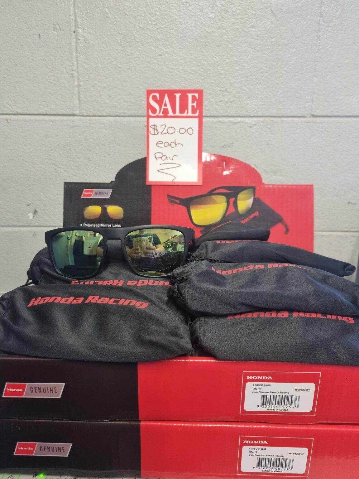A Display of Sunglasses With a Sale Sign Above Them — Urunga Chainsaw and Mower in Urunga, NSW