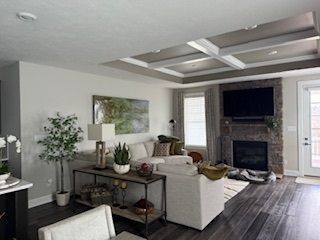 A living room filled with furniture and a fireplace.