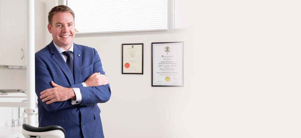 Dr John Webster in suit & tie