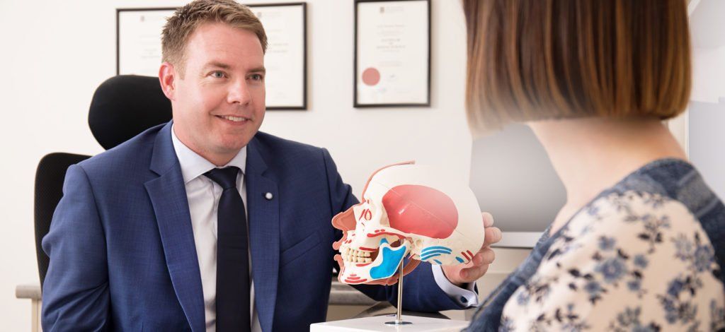 Dr Webster talking to a patient