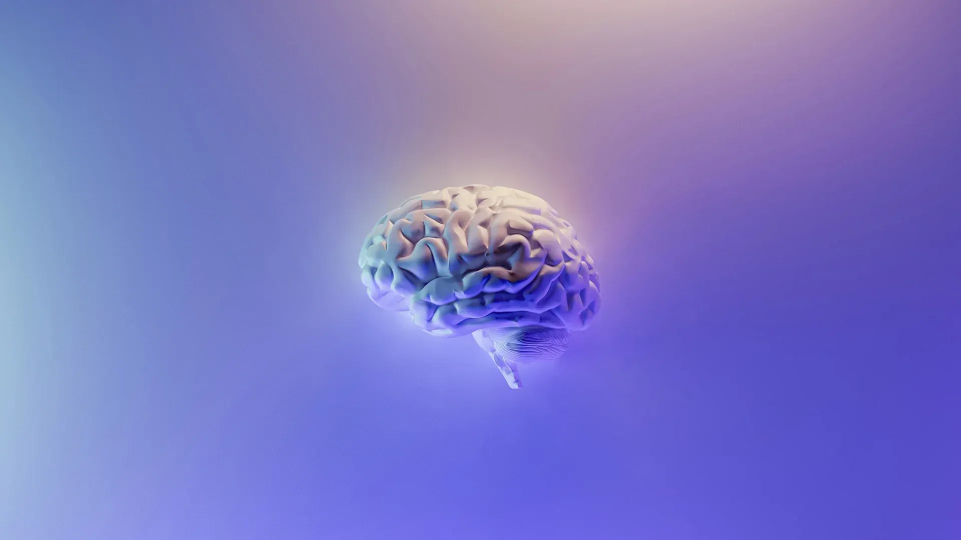 A glowing human brain in the center against a gradient blue-purple background.