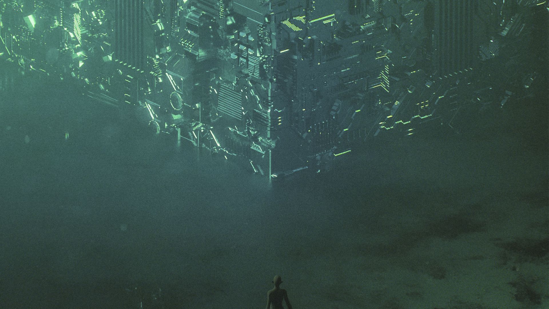 A futuristic city floats upside down in the sky, lit with green lights; a person stands below looking up.