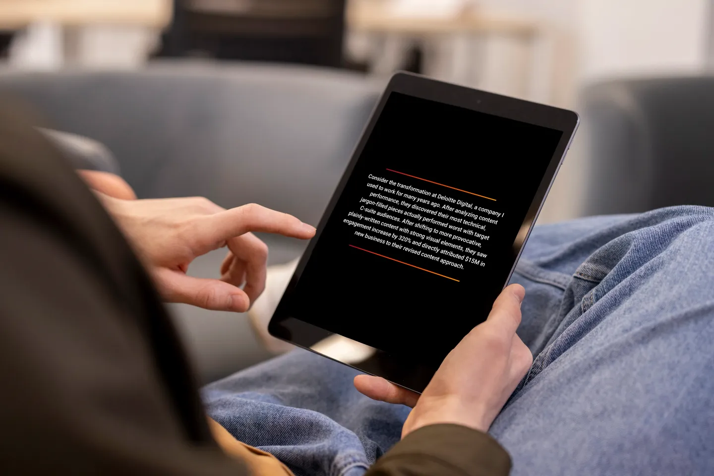 Smart Business Development e-Book displayed on a tablet held by a man in a sitting position