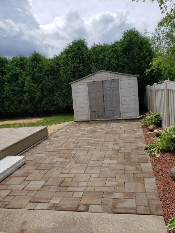 A newly install brick driveway for a shed in Janesville, WI by Malterer’s Landscaping