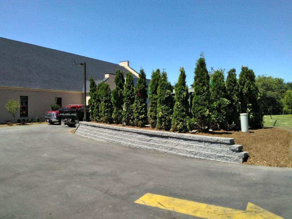 A parking lot with a yellow arrow pointing to the right