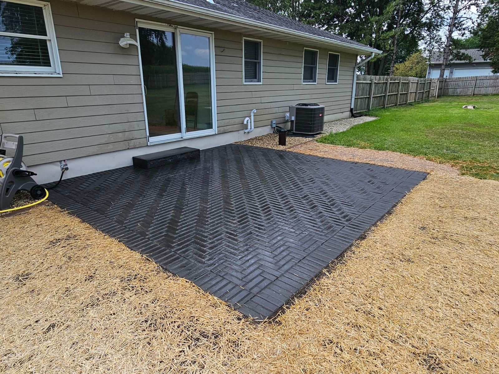 newly installed black brick patio