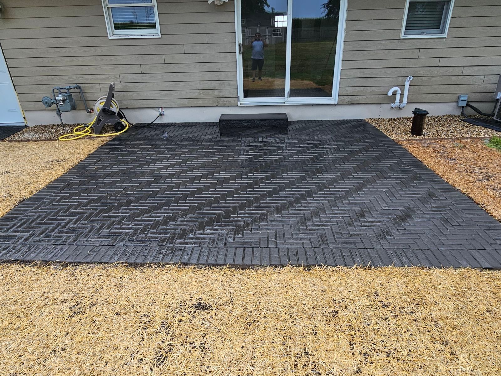 newly installed black brick patio