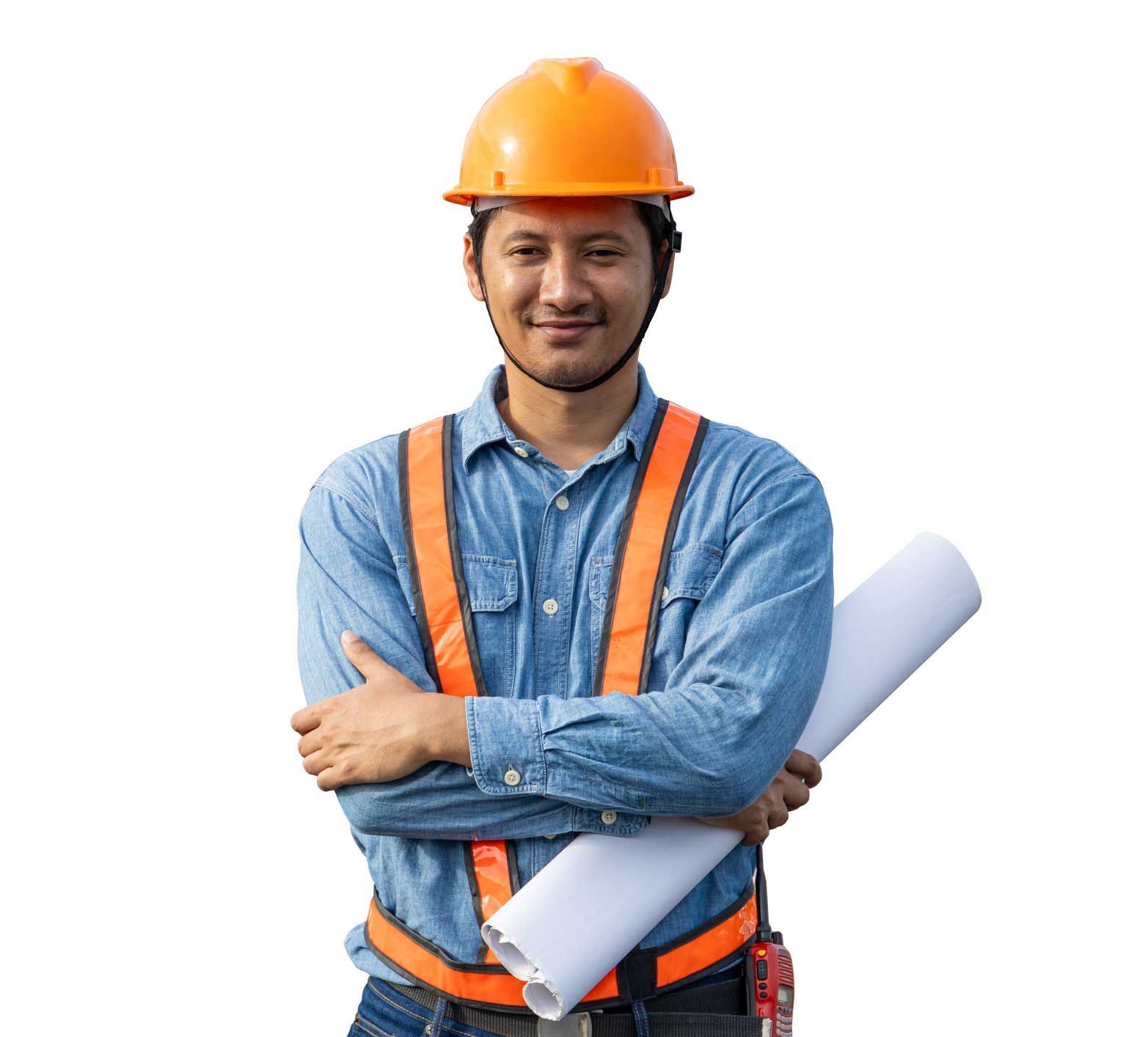 Construction worker in orange hard hat and safety vest, holding rolled blueprints and smiling.