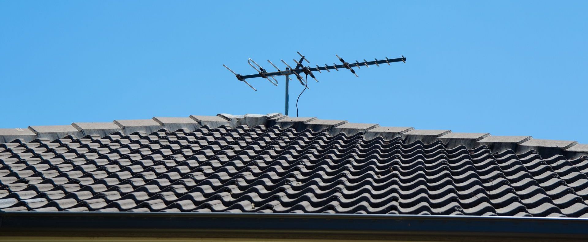 An artist 's impression of a house with a blue roof