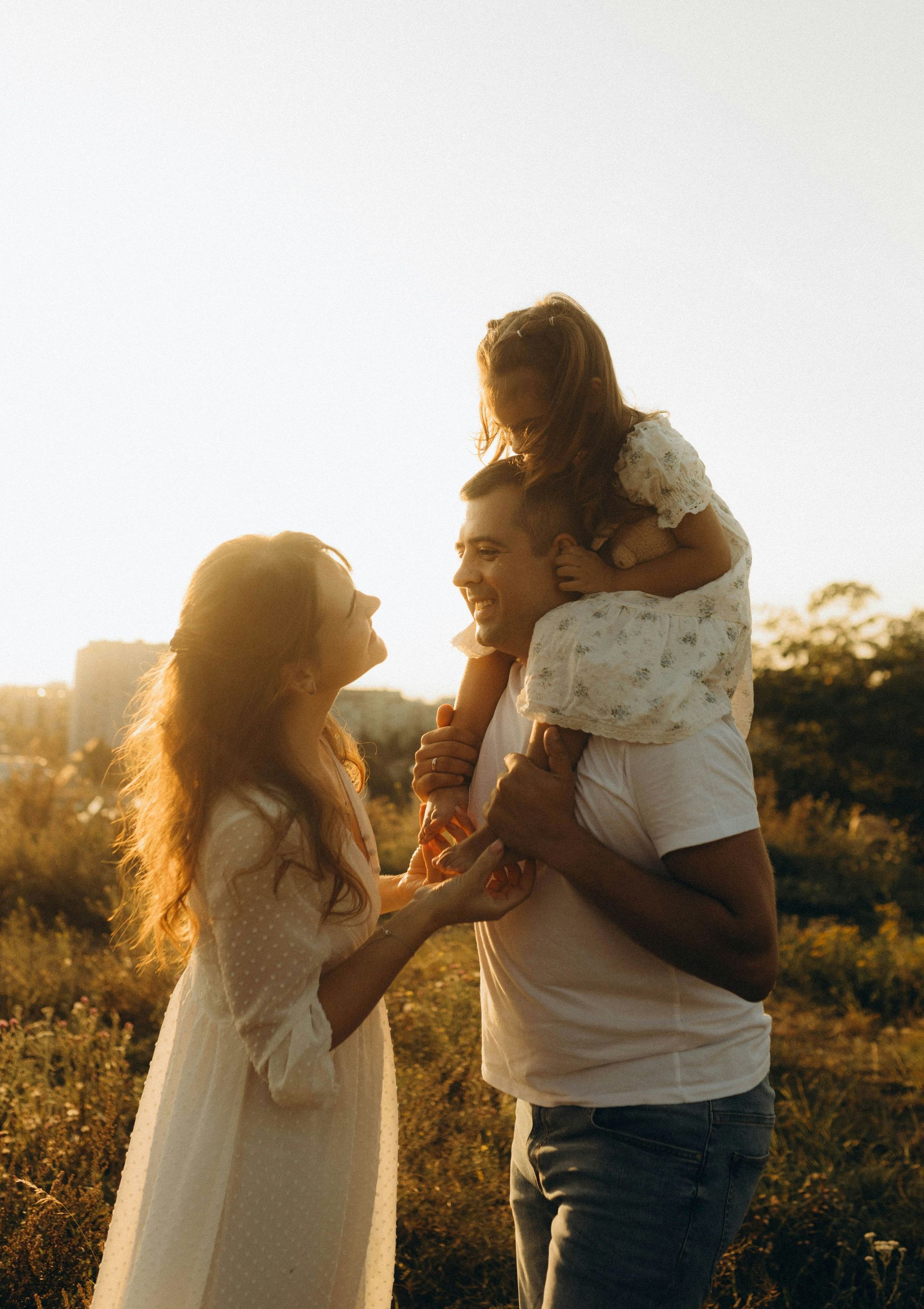 A woman is reading a book to a little girl