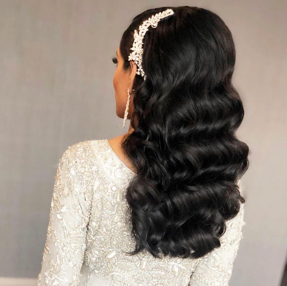 bride with hollywood curls and hair accessory