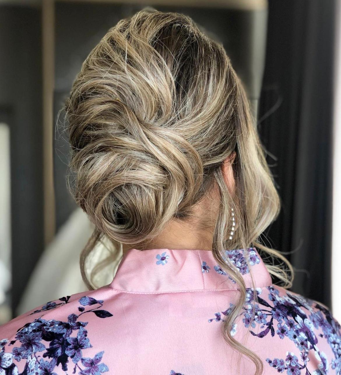 blonde woman with hair bun