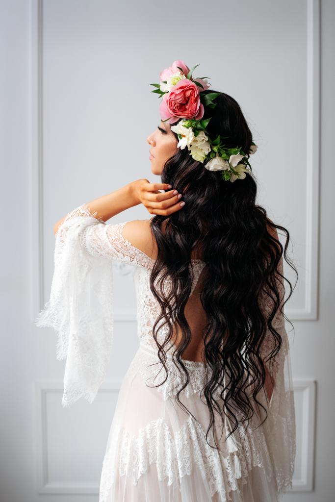 bohemian bride with flower crown long loose curls in hair