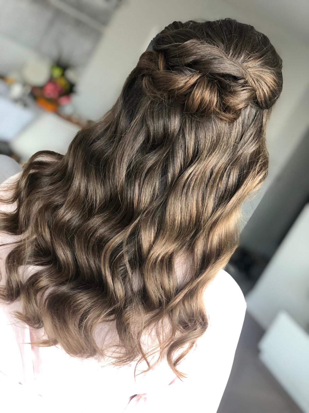 woman with loose waves and braid