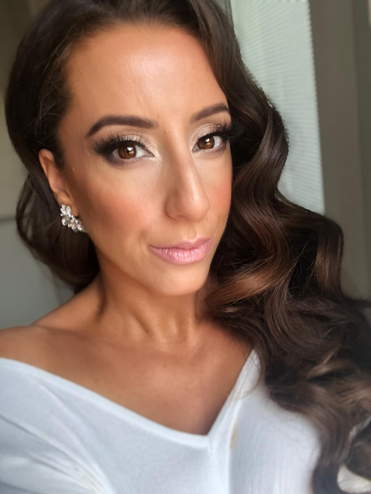 woman wearing professional makeup and eyelash extensions