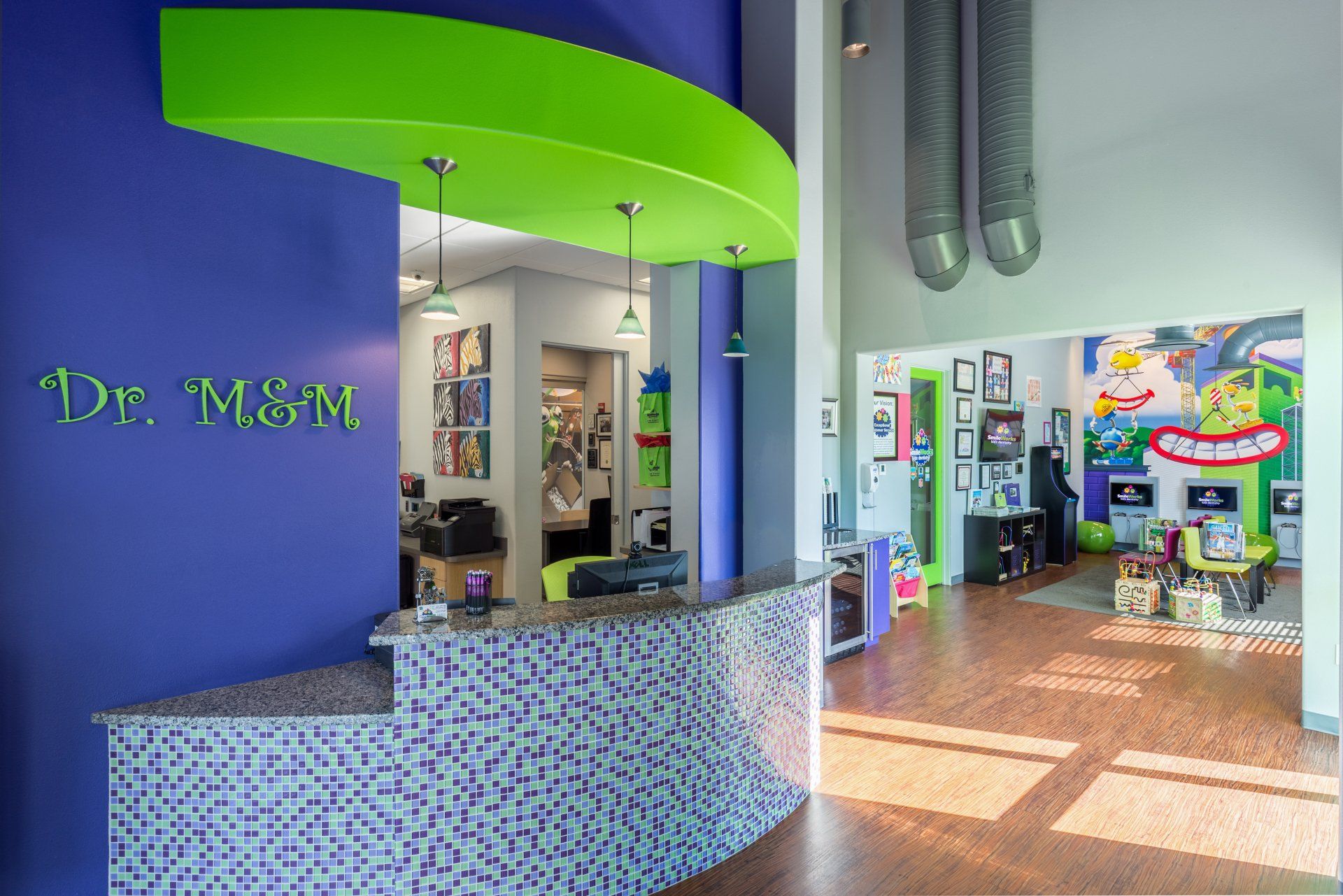 A dental office with a purple wall and a green counter.