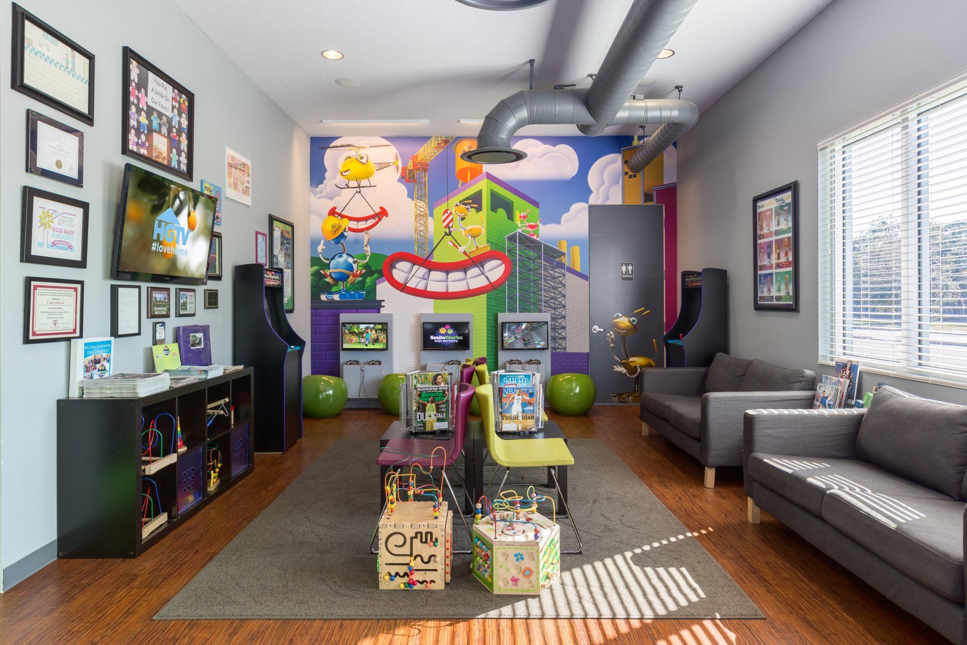 A living room with a couch and a mural on the wall