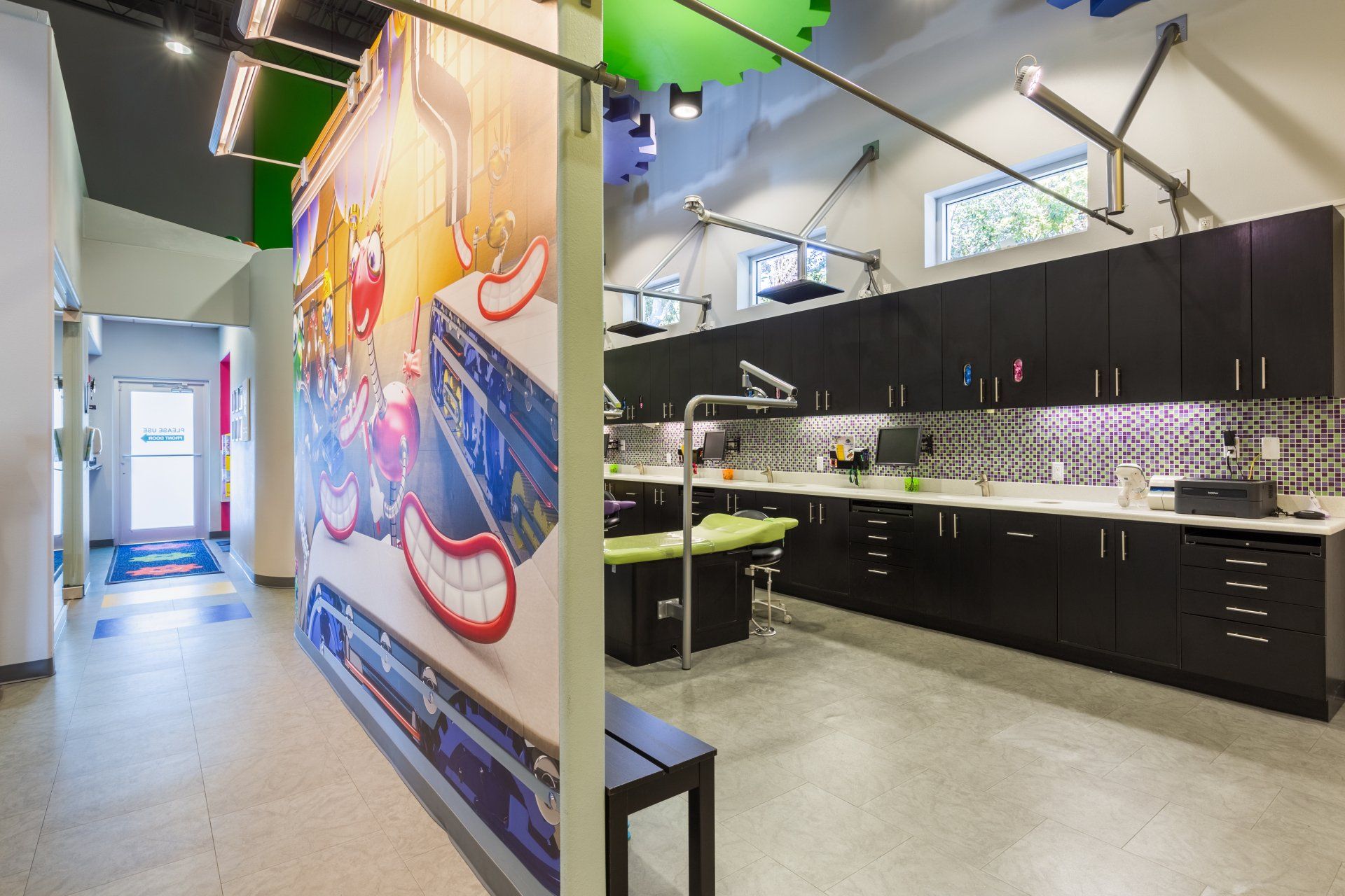 A dental office with a large mural on the wall