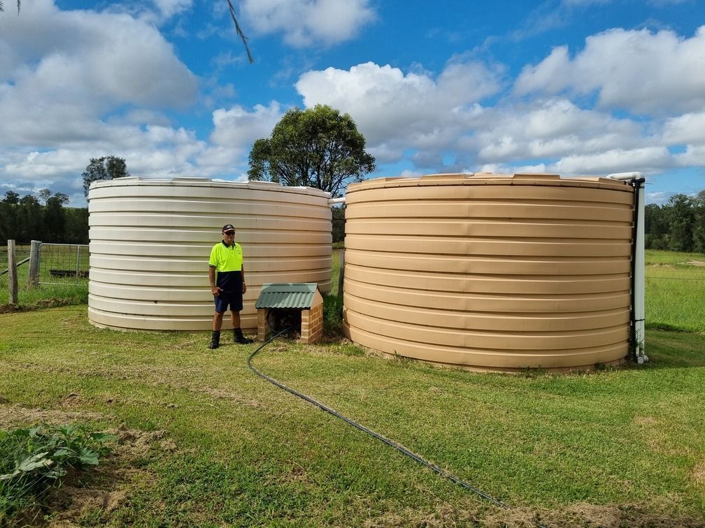 A White Truck Is Parked In Front Of A Garage — Clear and Clean Water Tank Cleaning Services in Bridgman, NSW