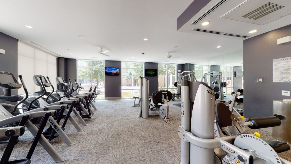gym with various workout equipment including weight machines and cardio machines