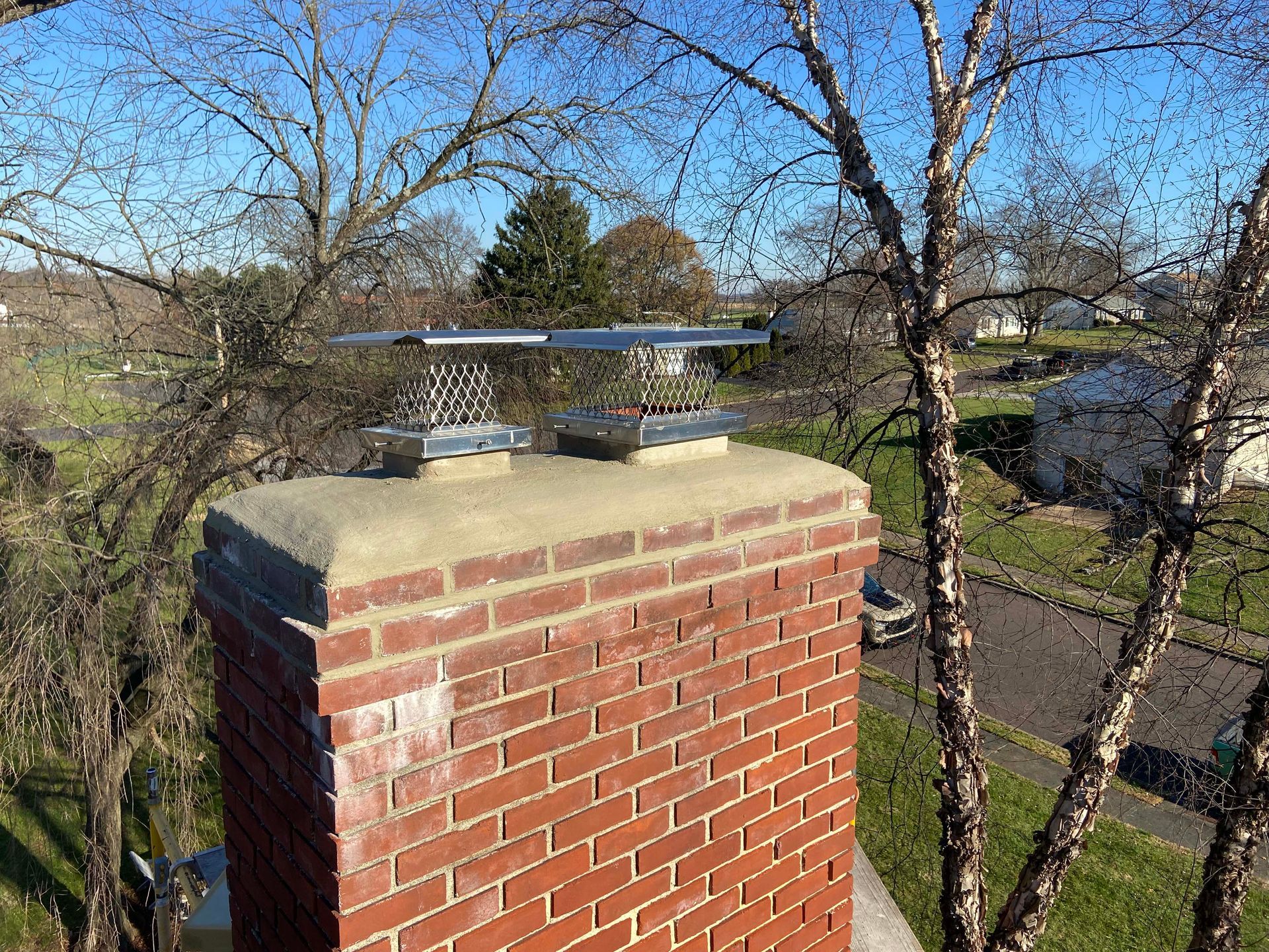 Close-up of a wall made of rectangular, light brown stone blocks with white mortar.