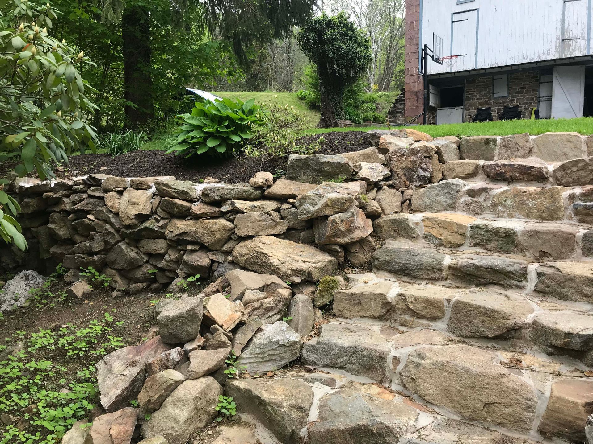 A floor being leveled with a spiked roller.