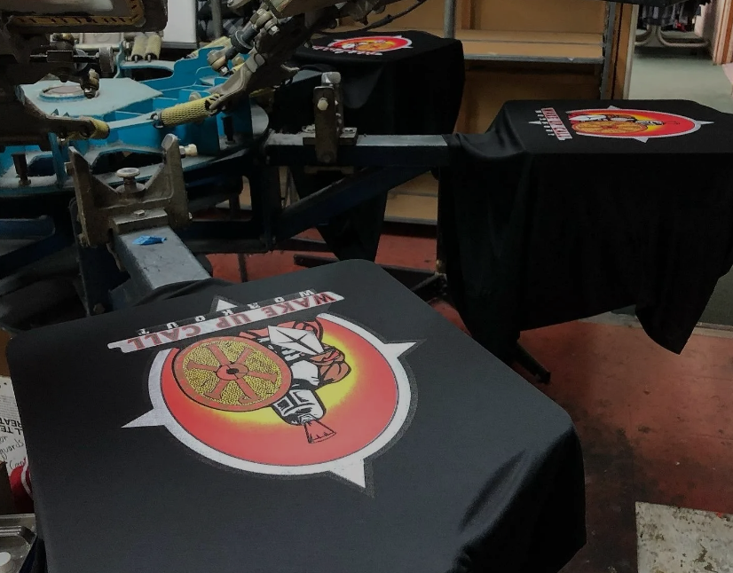 A T-shirt with a Logo on it is Being Printed on a Machine — Soquel, CA — Sport About Graphics