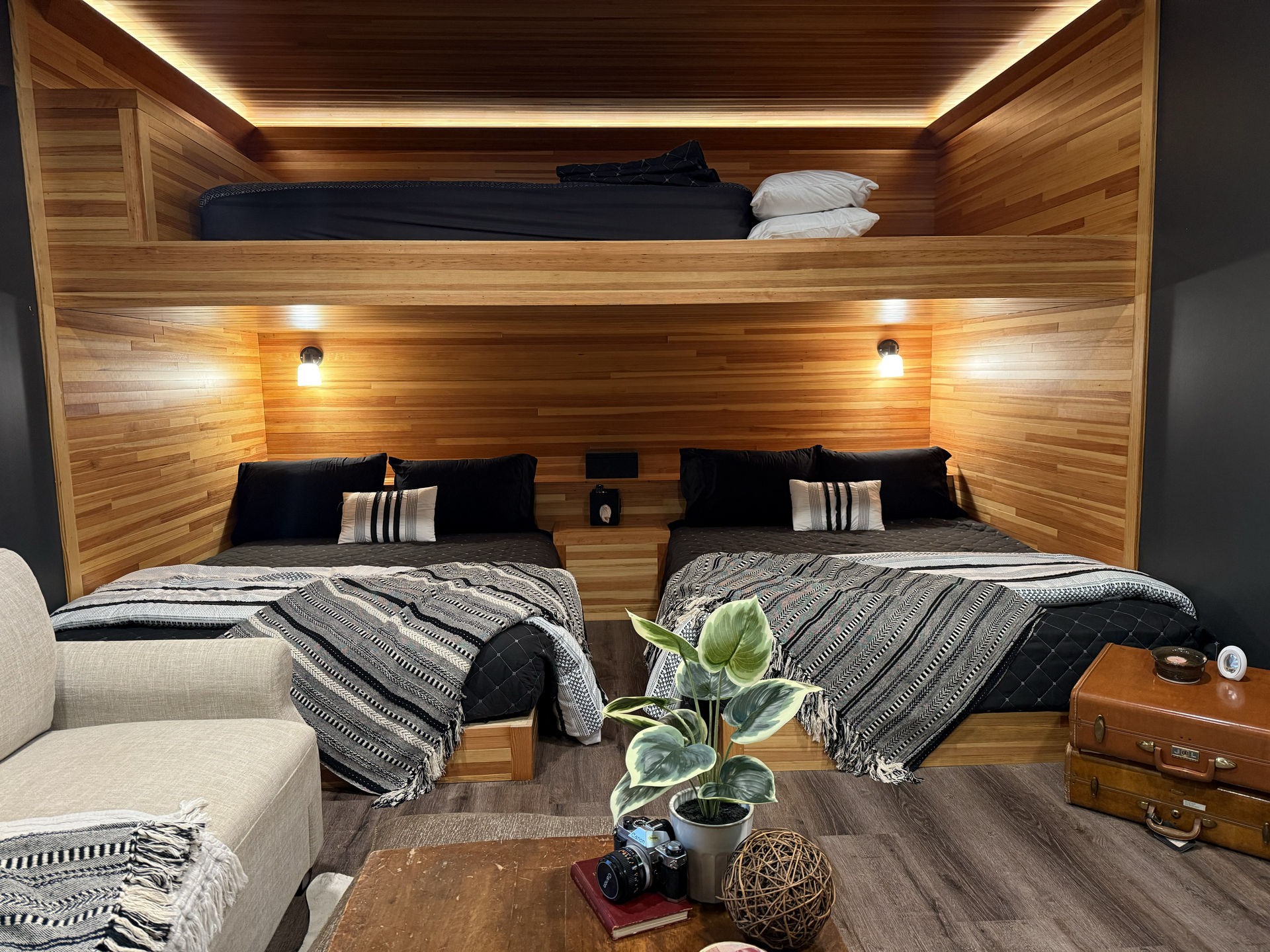 Wooden workshop with workbench, steps, and windows. Interior view with concrete floor.