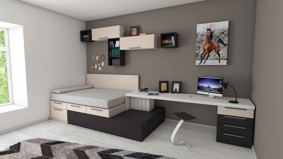 A bedroom with a bed , desk and computer.