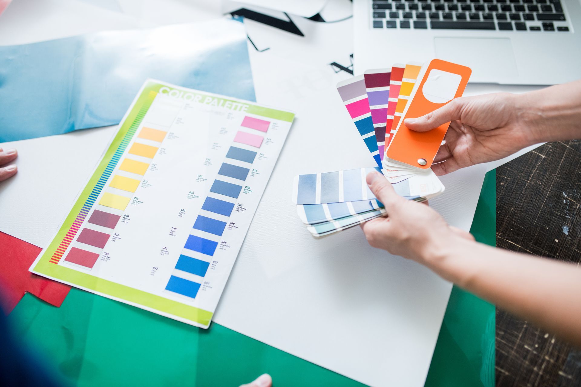 Working with the color palette, showcasing solutions for vibrant designs in a printer shop. Working with the color palette, showcasing solutions for vibrant designs in a printer shop.