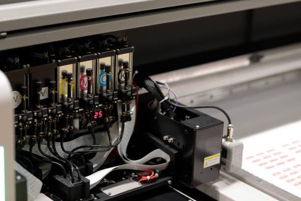A close-up of a printer with a bottle of ink next to it. - Port Saint John, FL - Shipping Depot of Port St John