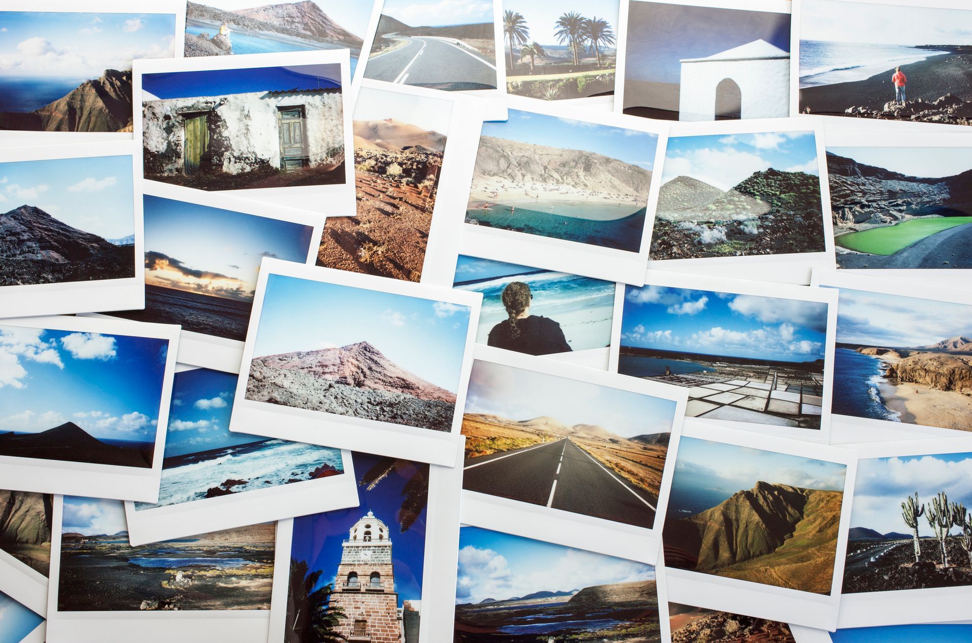 A bunch of pictures are stacked on top of each other on a wall. - Port Saint John, FL - Shipping Depot of Port St John