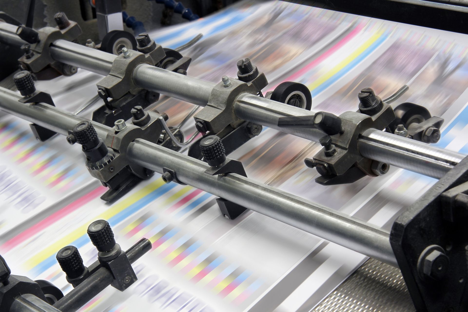Close-up of offset printing equipment in a banner print shop.