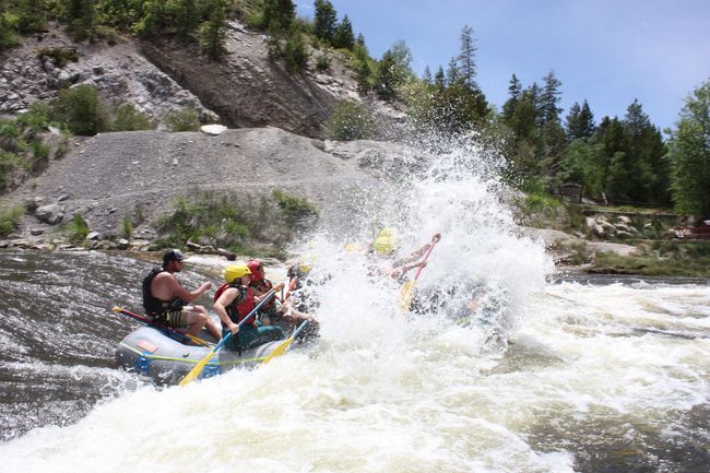 A group of people are rafting down a river.