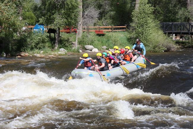 A group of people are rafting down a river.